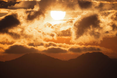 Low angle view of dramatic sky during sunset