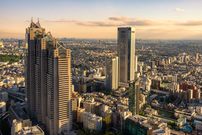 High angle view of city buildings during sunset