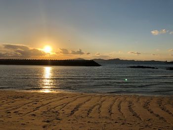 Scenic view of sea against sky during sunset