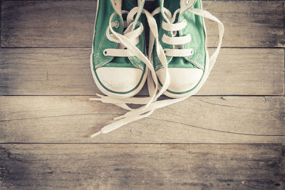 High angle view of shoes on hardwood floor