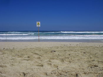 Scenic view of sea against blue sky