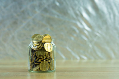 Close-up of glass jar on table