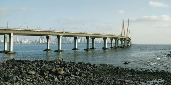 Bridge over sea against sky