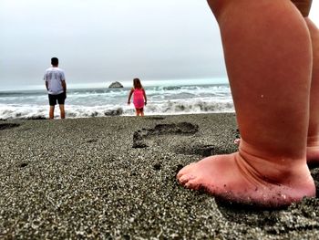 Woman standing on beach