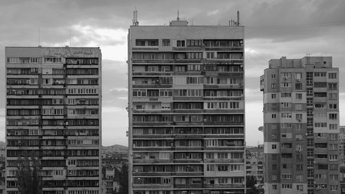 Low angle view of office buildings against sky