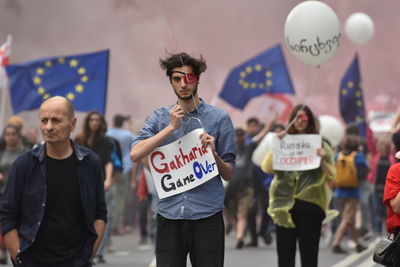 Group of people standing against blurred background