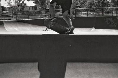 Low section of man skateboarding on skateboard