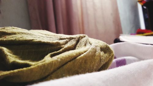 Close-up of blankets on bed at home