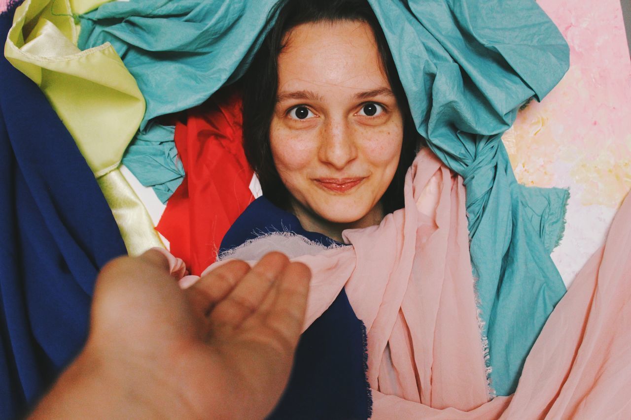 portrait, looking at camera, child, adult, emotion, women, childhood, blue, smiling, person, men, female, two people, headshot, baby, happiness, lifestyles, front view, human face, leisure activity, positive emotion, togetherness, lying down, high angle view, clothing, indoors, hand