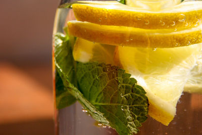 Close-up of lemon in glass