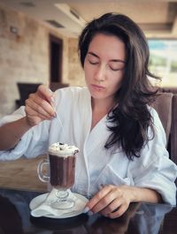 Woman holding coffee cup