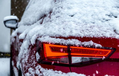 Detail shot of snowed headlight