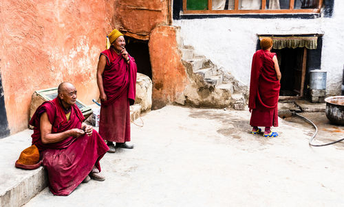 Rear view of people walking in a building