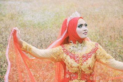 Close-up of young woman wearing traditional clothing