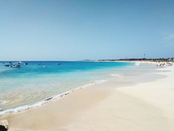 Scenic view of beach against clear sky