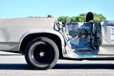 Vintage car on road against sky