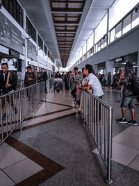 Group of people walking on airport