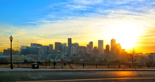 View of buildings in city during sunset