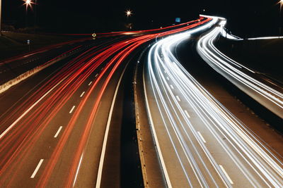 High angle view of light trails on road at night