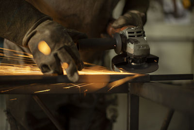 Metal processing with a grinder. sparks from the tool. 