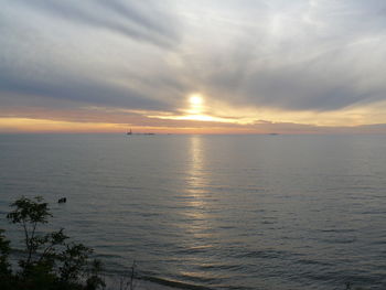 Scenic view of sea against sky at sunset