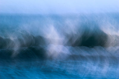 Close-up of water flowing over sea