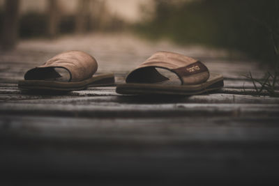 Close-up of shoes on table