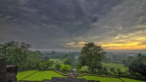 Scenic view of landscape against cloudy sky