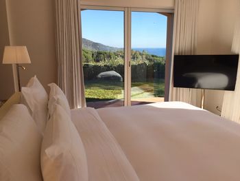 Close-up of bed on window at home