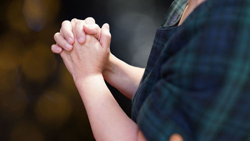 Midsection of woman with hands