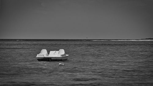 Boat in sea against clear sky