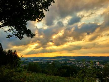 Scenic view of landscape against cloudy sky