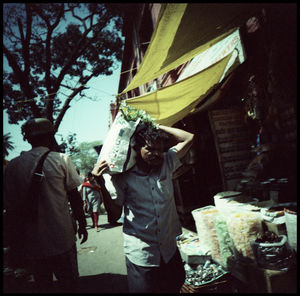 People standing on street in city