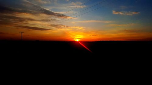 Scenic view of silhouette against sky during sunset