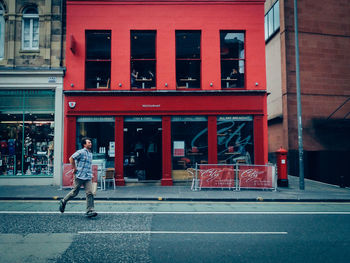 Woman standing on city street