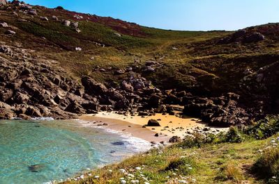 High angle view of sea and mountains against sky