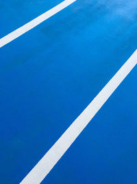 High angle view of arrow symbol on road