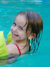 Young woman swimming in pool