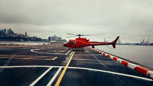 Helicopter used for sightseeing tours parked near hudson river in new york city