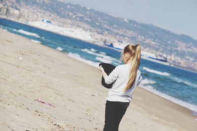 Woman standing on beach