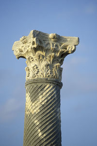 Low angle view of statue against blue sky