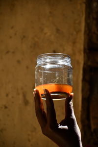 Cropped hand holding drink