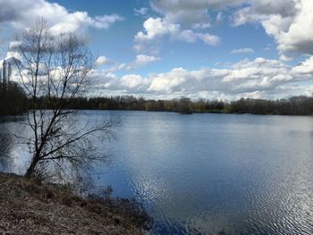 Scenic view of lake against cloudy sky