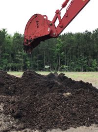 Construction site in field against sky