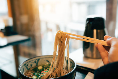 Close-up of man preparing food on table