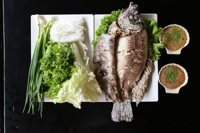 High angle view of fish in plate on table