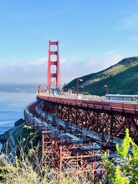 Bridge over sea against sky