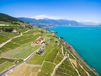 High angle view of sea and mountains against sky