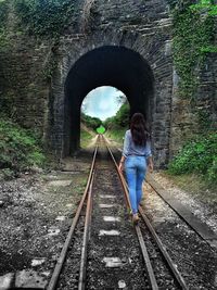 People walking in tunnel