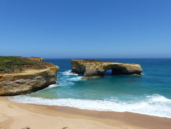 Scenic view of sea against clear blue sky